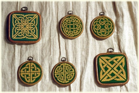 Picture of 4 gold knotwork medallions and 2 panels